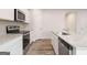 Modern kitchen featuring stainless steel appliances, granite countertops and white cabinets at 7222 Lacey Dr. # 127, Douglasville, GA 30134