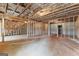Unfinished basement shows framed walls, insulation, and concrete floor at 130 Windchime Way # 9, Tyrone, GA 30290