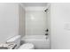 Bathroom featuring a bathtub with tiled surround, shower, and toilet at 130 Windchime Way # 9, Tyrone, GA 30290