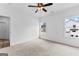 Bedroom featuring neutral carpet, ceiling fan and two windows at 130 Windchime Way # 9, Tyrone, GA 30290