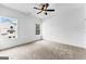 Bedroom featuring neutral carpet, ceiling fan and two windows at 130 Windchime Way # 9, Tyrone, GA 30290