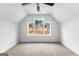 Bright bedroom with a ceiling fan and a view of the outdoors through the large windows at 130 Windchime Way # 9, Tyrone, GA 30290