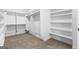 Bright walk-in closet with carpet and built-in shelves at 130 Windchime Way # 9, Tyrone, GA 30290