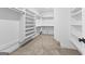 Walk-in closet with carpet flooring and built-in shelving at 130 Windchime Way # 9, Tyrone, GA 30290