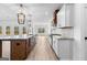 Open concept kitchen showcasing a center island, white cabinetry, and modern appliances at 130 Windchime Way # 9, Tyrone, GA 30290