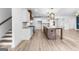 Spacious kitchen features a large island, stainless steel appliances, and pendant lighting at 130 Windchime Way # 9, Tyrone, GA 30290