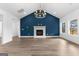 Bright living room with a vaulted ceiling, wood-look flooring and lots of natural light at 130 Windchime Way # 9, Tyrone, GA 30290