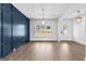 Spacious living room featuring wood floors, large windows, and custom wall trim at 130 Windchime Way # 9, Tyrone, GA 30290