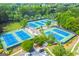 Aerial view of the neighborhood tennis courts and surrounding greenery at 3435 Vista Creek Dr, Dacula, GA 30019