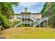 View of the home's rear exterior with multiple decks and yard space at 3435 Vista Creek Dr, Dacula, GA 30019