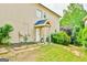 Exterior of home showing door with small awning, landscaping, and lawn at 3435 Vista Creek Dr, Dacula, GA 30019