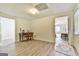 Finished basement area with wood flooring, desk, chairs, neutral paint, and access to other rooms at 3435 Vista Creek Dr, Dacula, GA 30019
