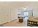 Finished basement with bedroom area, closet, seating area, and wood laminate flooring at 3435 Vista Creek Dr, Dacula, GA 30019