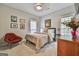 Cozy bedroom featuring a bed, stylish furnishings, natural lighting and carpeted floors at 3435 Vista Creek Dr, Dacula, GA 30019