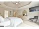 Bedroom with hardwood floors, trey ceiling, large bed, sitting area, and natural light at 3435 Vista Creek Dr, Dacula, GA 30019
