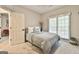 Bedroom featuring a large window, neutral carpet, neutral decor and lots of natural light at 3435 Vista Creek Dr, Dacula, GA 30019