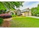 Inviting home with lush landscaping and a side-entry garage at 3435 Vista Creek Dr, Dacula, GA 30019