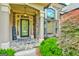 Charming front porch with stone accents, decorative door, and inviting entryway at 3435 Vista Creek Dr, Dacula, GA 30019