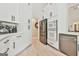 Kitchen area featuring stainless steel appliances and white cabinets with sleek black hardware at 3435 Vista Creek Dr, Dacula, GA 30019