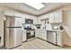 Well-lit kitchen with stainless steel appliances, white cabinetry, and modern countertops at 3435 Vista Creek Dr, Dacula, GA 30019