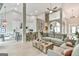 Bright, open-concept living room featuring modern decor and seamless integration with the kitchen at 3435 Vista Creek Dr, Dacula, GA 30019