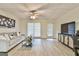 Inviting living area with comfortable seating, entertainment center, and large window at 3435 Vista Creek Dr, Dacula, GA 30019