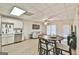Open-concept kitchen, dining, and living area, featuring stainless steel appliances and comfortable seating at 3435 Vista Creek Dr, Dacula, GA 30019