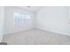 Clean and bright bedroom featuring neutral carpet, natural light, and a closet at 1870 Wildcat Trace Cir, Lawrenceville, GA 30043
