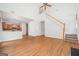 Open-concept living room with hardwood floors, staircase, and a glimpse of the adjacent kitchen at 1870 Wildcat Trace Cir, Lawrenceville, GA 30043