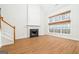 Bright living room with a fireplace, a large window, and wood-look flooring at 1870 Wildcat Trace Cir, Lawrenceville, GA 30043