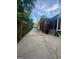Long driveway alongside a brick home with a screen porch at 4111 Scott Dr, Forest Park, GA 30297