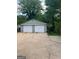 Detached two-car garage with ample parking space on a concrete driveway at 4111 Scott Dr, Forest Park, GA 30297