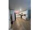Bright kitchen with white cabinets, stainless steel appliances, and light-colored hardwood floors at 4111 Scott Dr, Forest Park, GA 30297
