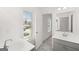 Bathroom with double sinks, neutral tones, and modern finishes at 1809 Quaker, Hampton, GA 30228