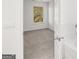 Neutral bedroom with an ensuite bath, featuring carpeted floors, and natural light at 1809 Quaker, Hampton, GA 30228