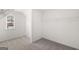 Spacious closet with shelving and carpeted floors at 1809 Quaker, Hampton, GA 30228