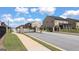 Gated entrance to a residential community with manicured lawns and sidewalks at 1809 Quaker, Hampton, GA 30228