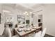 Open dining room with coffered ceilings, modern decor, and ample seating for Gathering meals at 1809 Quaker, Hampton, GA 30228