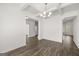 Elegant dining room featuring hardwood floors, coffered ceilings, and stylish chandelier at 1809 Quaker, Hampton, GA 30228