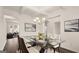 Dining room featuring modern lighting, a glass table, and seating for six at 1809 Quaker, Hampton, GA 30228