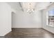An empty dining area, featuring modern wood flooring and lighting at 1809 Quaker, Hampton, GA 30228