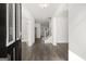 Inviting entryway showcasing hardwood floors and an open floor plan leading to the staircase at 1809 Quaker, Hampton, GA 30228
