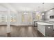 Bright, open-concept kitchen with stainless steel appliances and a center island with bar seating at 1809 Quaker, Hampton, GA 30228