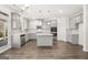 Modern kitchen with white cabinets, stainless steel appliances, and a center island with barstool seating at 1809 Quaker, Hampton, GA 30228