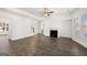 Spacious living room with a fireplace, hardwood floors, and an open layout at 1809 Quaker, Hampton, GA 30228