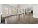 Spacious living area features wood floors and many windows with views at 1809 Quaker, Hampton, GA 30228