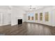 Cozy living room with a fireplace and large windows that provide natural light at 1809 Quaker, Hampton, GA 30228