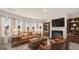 Cozy living room features modern fireplace and large windows at 1809 Quaker, Hampton, GA 30228