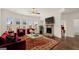 Comfortable living room featuring a fireplace and large windows at 1809 Quaker, Hampton, GA 30228