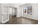 Spacious living room featuring hardwood floors, bright windows, and french doors at 1809 Quaker, Hampton, GA 30228